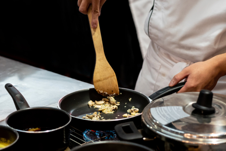 Chef preparing food in the kitchen, chef cooking, closeupの写真素材