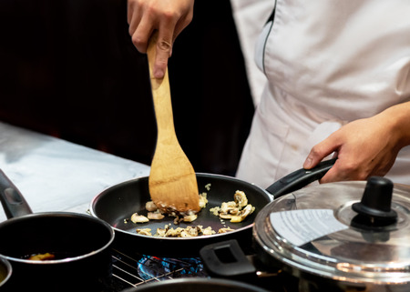 Chef preparing food in the kitchen, chef cooking, closeupの写真素材