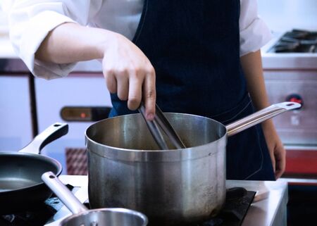 Chef cooking food in the kitchen, Chef preparing foodの写真素材