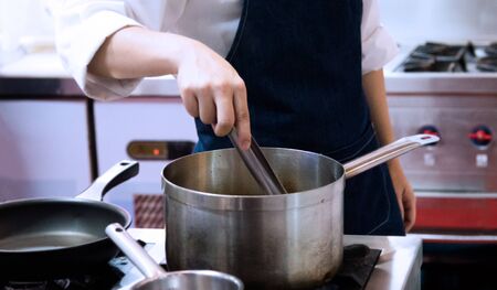 Chef cooking food in the kitchen, Chef preparing foodの写真素材