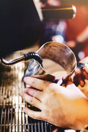Espresso machine brewing milkの写真素材