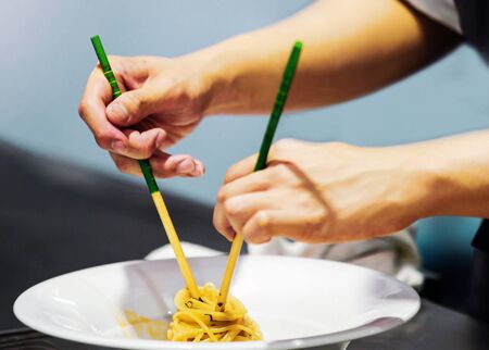 Chef decorating dish, closeup
