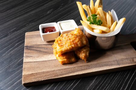 Traditional British Fish and Chips with french friesの写真素材