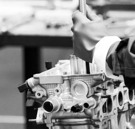 Engine repair, Car mechanic repairing a car engine