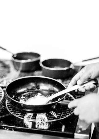 Chef cooking in a kitchen, chef at work, Black & White
の写真素材