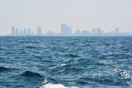 The blue sea with city backgroundの写真素材