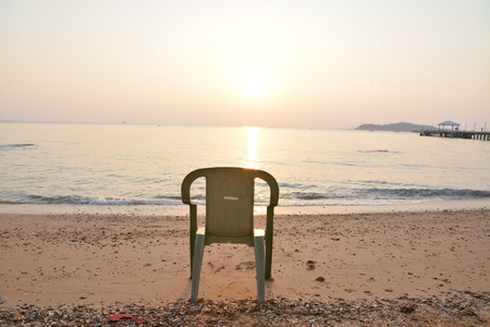 chairs on the beach in sun riseの写真素材