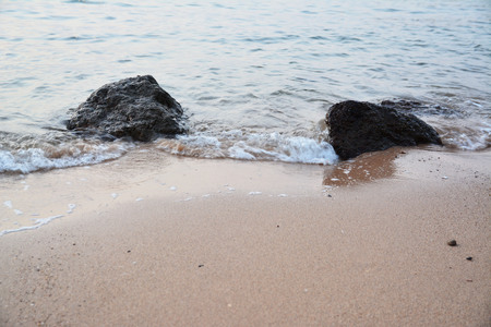 Soft wave on beach in sunriseの写真素材