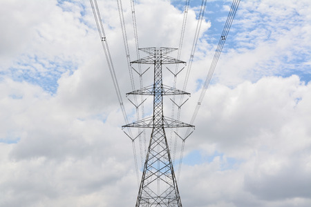 high voltage pole with blue sky backgroundの写真素材