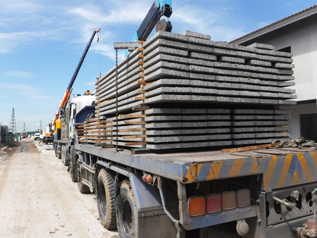 Precast plank concrete slabs on trucks at site construction