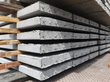 Precast plank concrete slabs on trucks at site constructionの写真素材