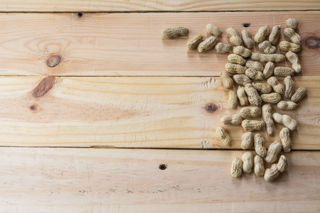 close up peanuts on wooden backgroundの写真素材