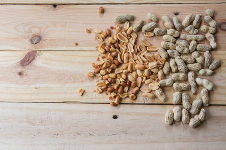 close up peanuts on wooden backgroundの写真素材