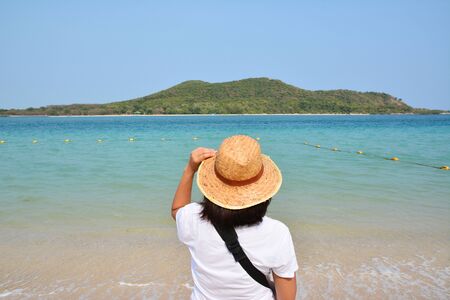 A traveler looking sea  at sea Thailandの写真素材