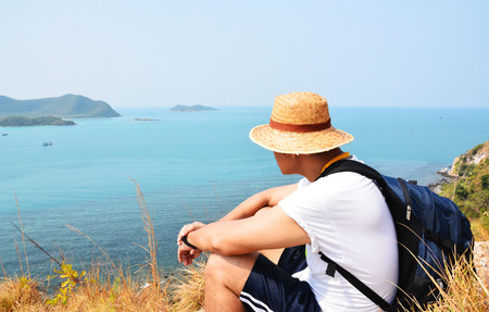 A traveler looking sea  at sea Thailandの写真素材