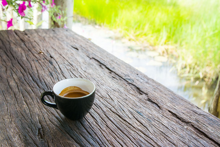 Cup of espresso coffee on old wood tableの写真素材