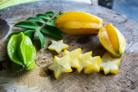 Star fruit on old wood background