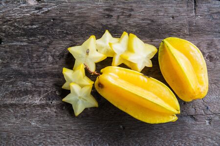 Star fruit on old wood backgroundの写真素材
