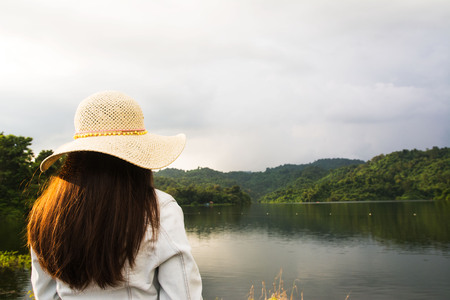 Female traveler looking at the lakeの写真素材
