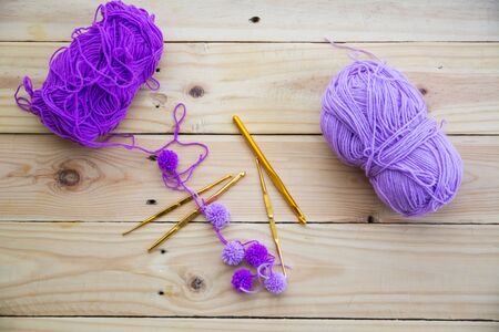 Yarn for knitting on wooden  backgroundの写真素材