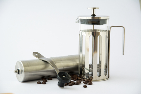 Coffee grinder with french press on white backgroundの写真素材