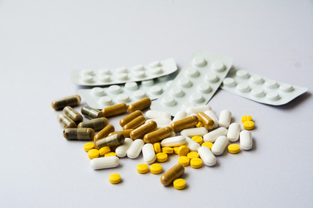Pharmacy background white and yellow medicine pills