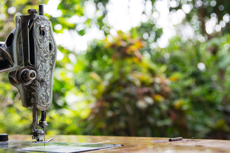Closeup of an old hand sewing machine with vintage style