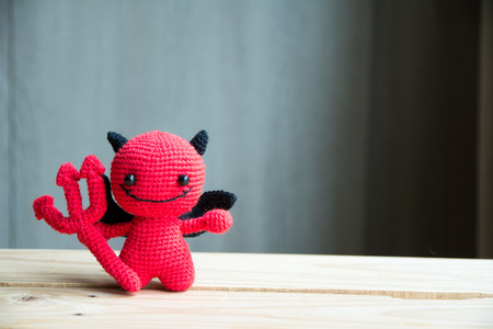 Red devil dolls of yarn