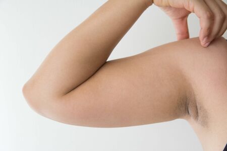 Women fat with arm fat on white backgroundの写真素材