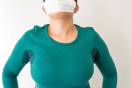 Close-up  woman with hyperhidrosis sweating Armpit wet