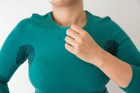 Close-up  woman with hyperhidrosis sweating Armpit wet