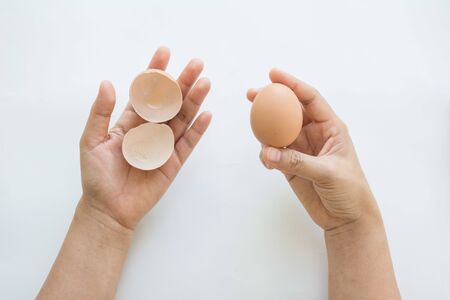 Hand with eggs  isolated on white background