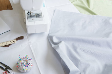 Dressmaker's desk sewing machine and Fabric cutting toolsの写真素材
