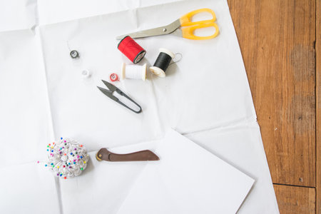 Dressmaker's desk sewing machine and Fabric cutting toolsの写真素材