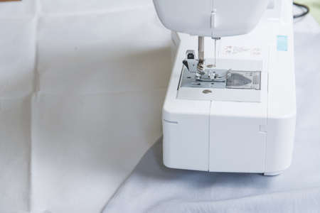 Close up shot white sewing machine