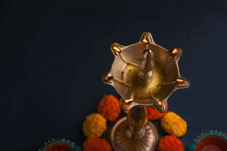 Colorful clay diya lamps lit during diwali celebration