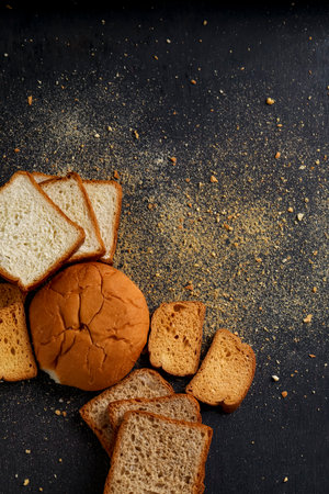 Bakery product, crispy and dry khari or puff,rusk and bun with copy (tex) space over dark background