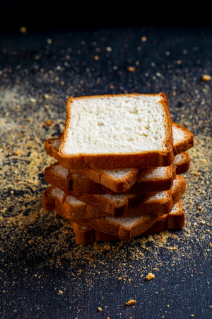 Cut of loaf bread on white against white background