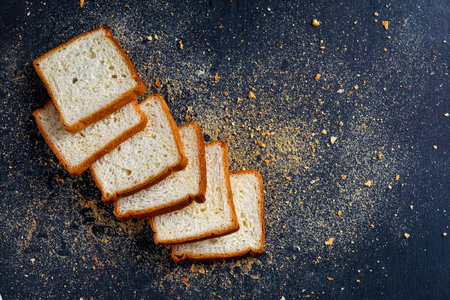Cut of loaf bread on white against white background