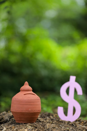 American Dollar symbol and clay piggy bankの写真素材
