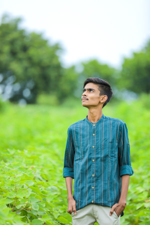 Young indian man showing expression over nature backgroundの写真素材