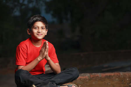 cute indian little child prayingの写真素材