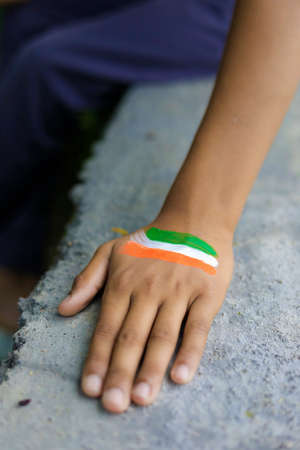 indian flag on hand and wrist of Indian childの写真素材