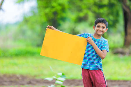 kid planting tree and showing empty board