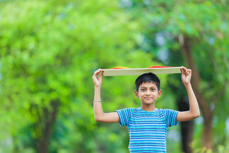 kid planting tree and showing empty board