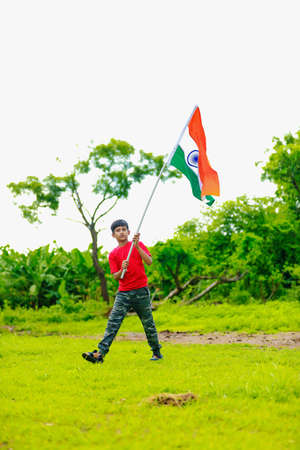 Cute little boy with Indian National Tricolor Flagの写真素材