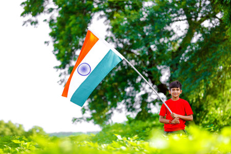 Cute little boy with Indian National Tricolor Flagの写真素材