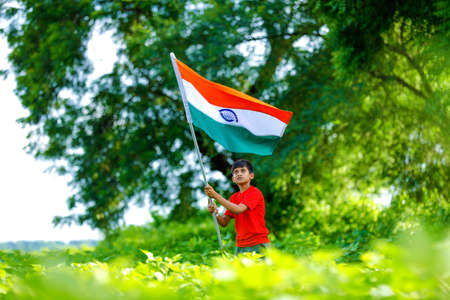 Cute little boy with Indian National Tricolor Flagの写真素材