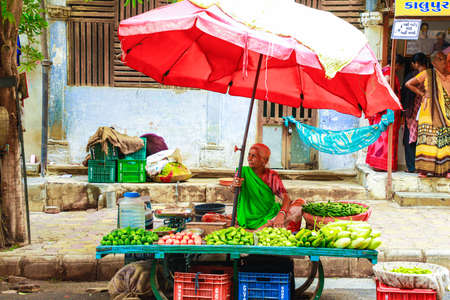 Indian selling vegetable at marketのeditorial素材