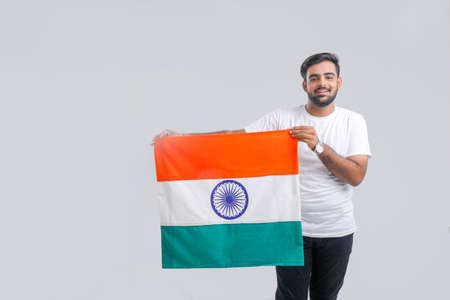 Young indian man with indian flag